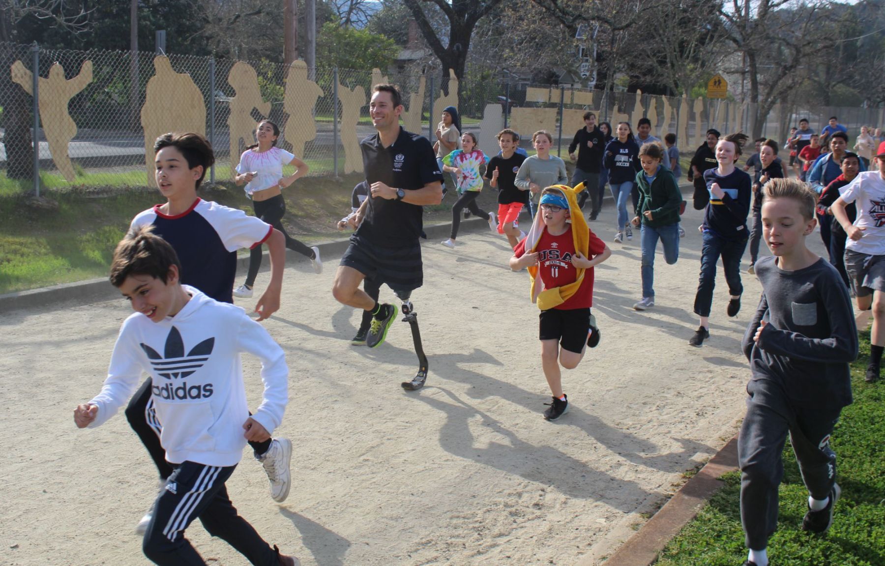 Andre Barbieri runs with RLS students